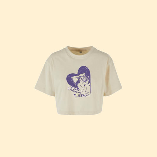 Beige t-shirt crop top with a graphic design on a beige background
