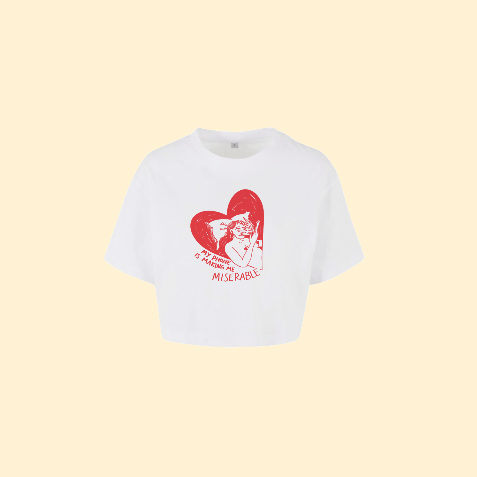 White t-shirt crop top with red graphic and text on a beige background