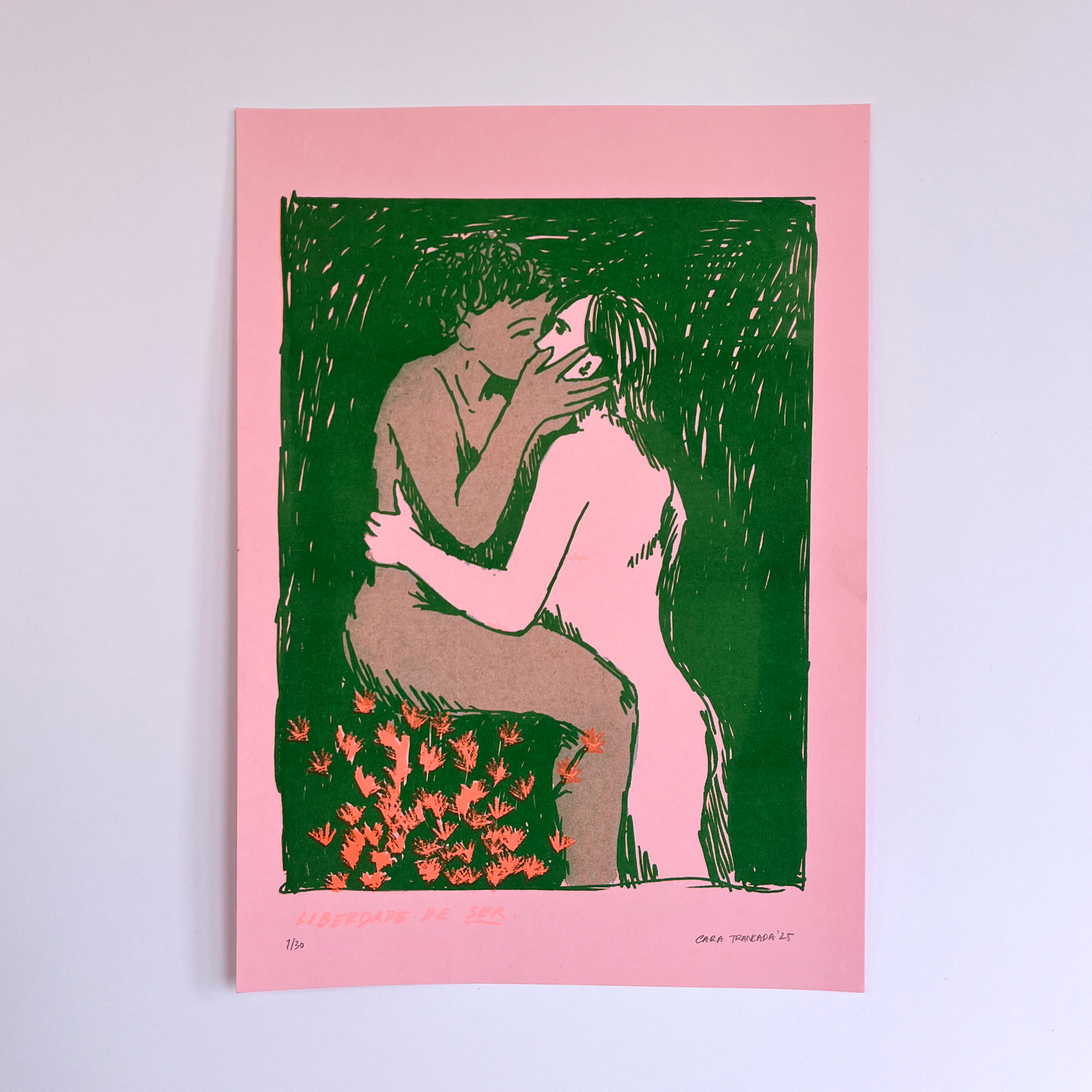 Portrait of two people kissing in green, with red flowers below