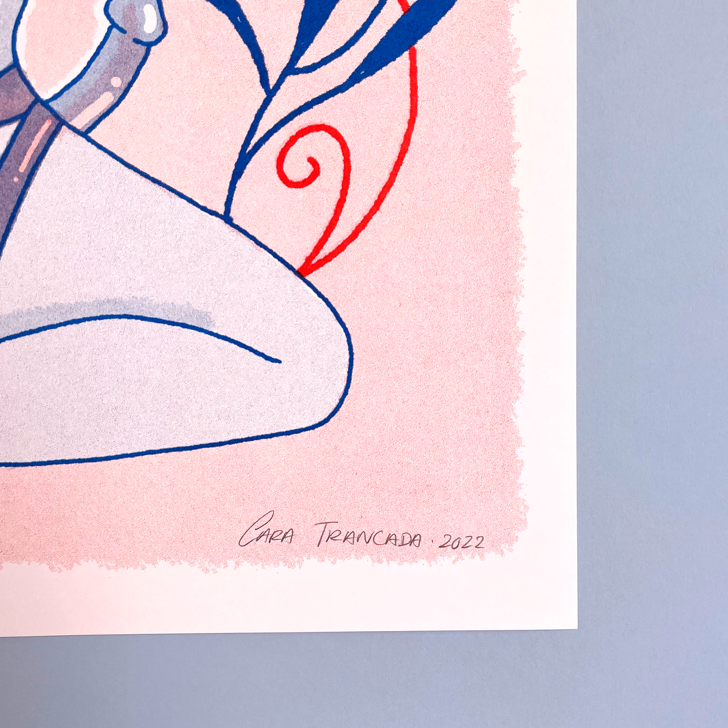 detail of signature in print of woman sensual in pastel pink background