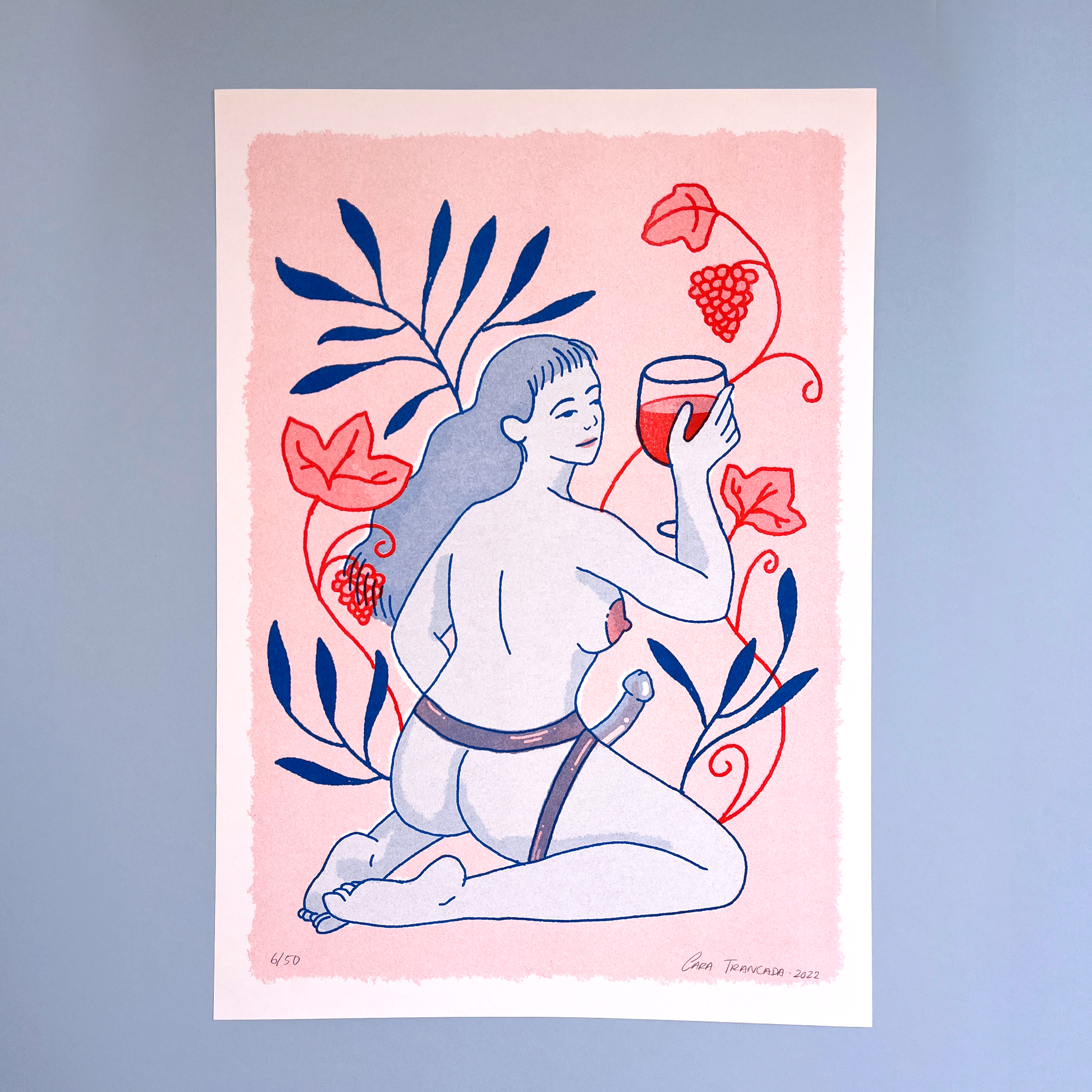 woman sensual with wine cup and grapes in pastel pink background